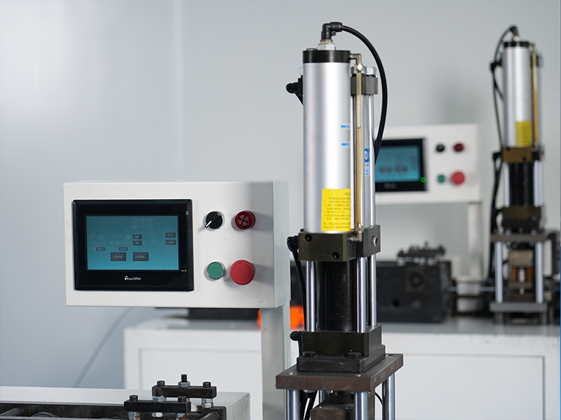 Close-up of pneumatic automation equipment used in the air filter assembly process