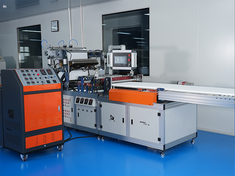Advanced mini-pleat filter manufacturing equipment processing white filter media in a cleanroom