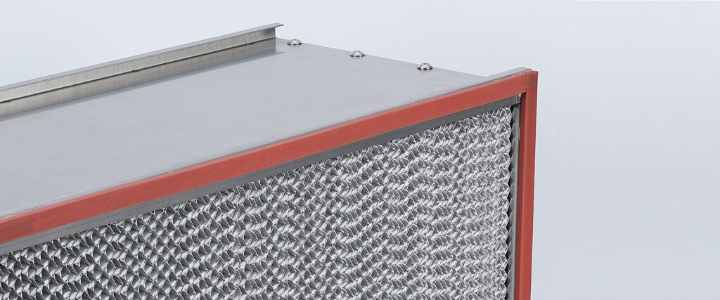 Close-up detail of chemical air filter construction featuring a red silicone sealing gasket and rigid metal frame